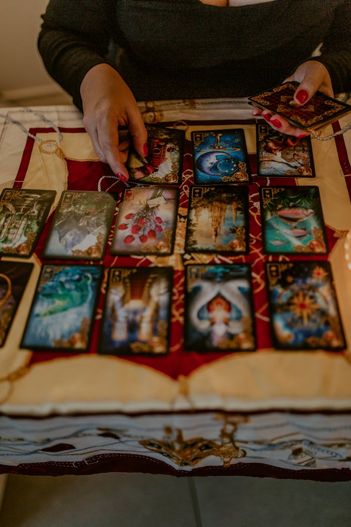 Person engaging in a mystical tarot card reading session, exploring fate and destiny.